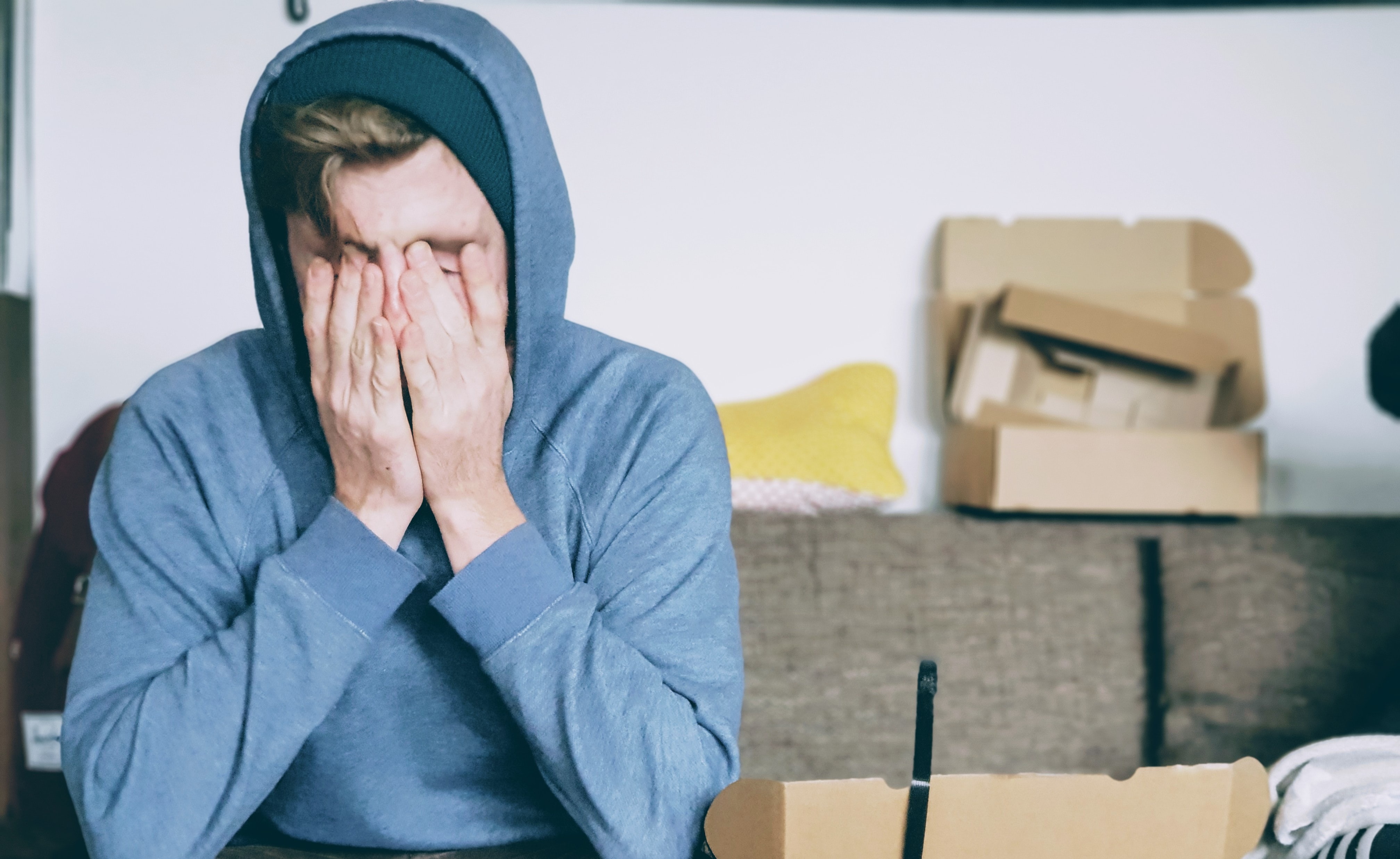 Man Stressed Out and Covering Face